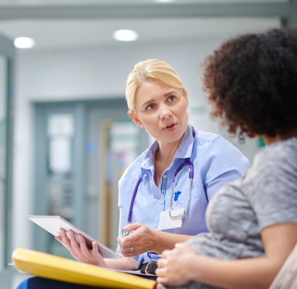 Maternity event - Medical professional consulting a pregnant patient