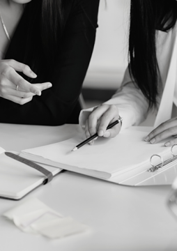 two people looking at a folder